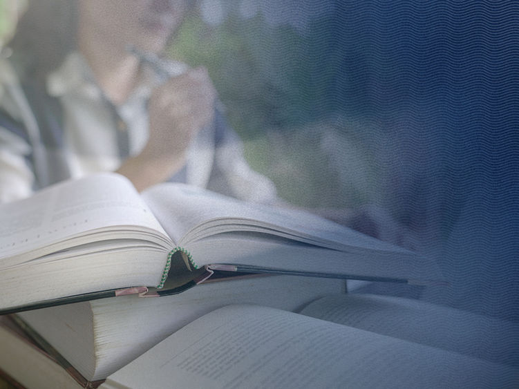 Textbooks in focus with out of focus student in background and blue gradient overlay with s-curve design