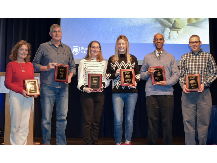 Group photo of Penn State Schuylkill faculty and staff holding awards