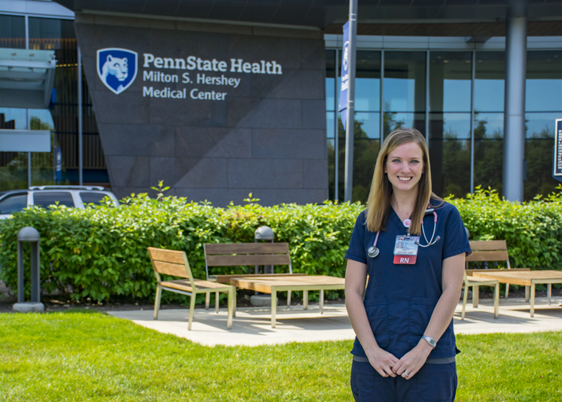 Anastasia Barnhardt stands in front of Penn State Health Milton S. Hershey Medical Center.